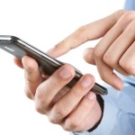 Close up of man using smart phone isolated on white background